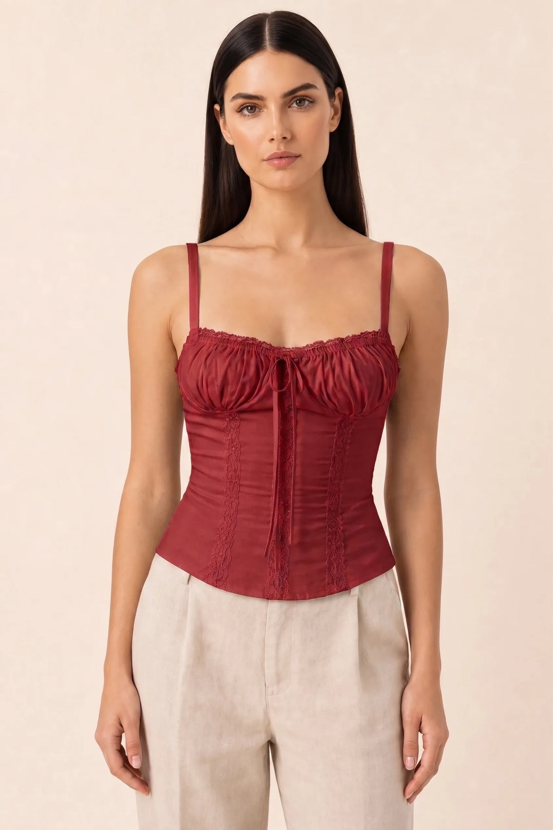 Red lace trim corset cami on a model in a contrapposto stance