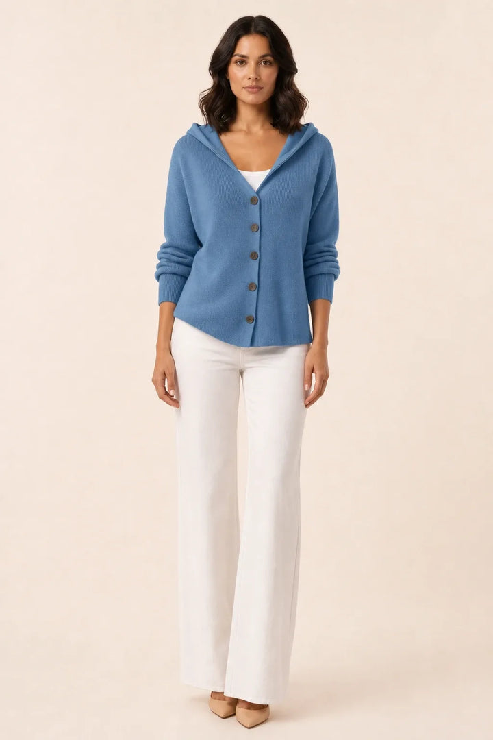 Blue hooded button cardigan on a model in a contrapposto stance