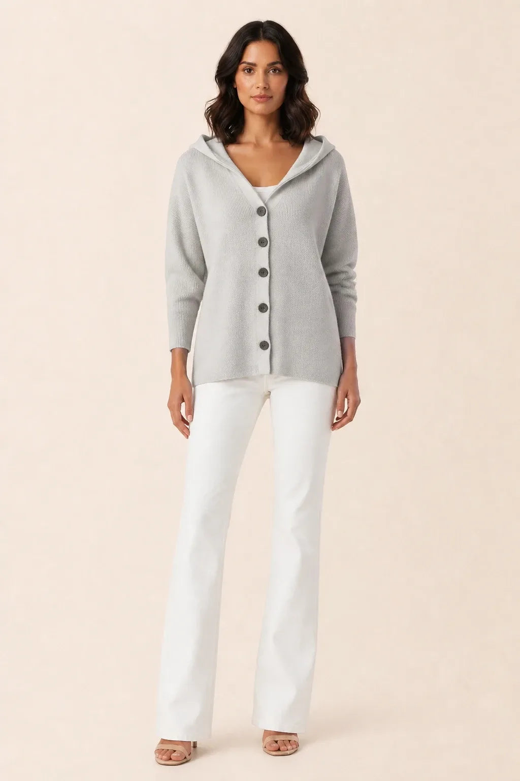 Gray hooded button cardigan on a model in a contrapposto stance