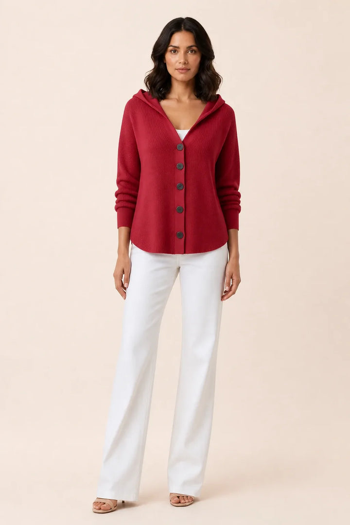 Red hooded button cardigan on a model in a contrapposto stance