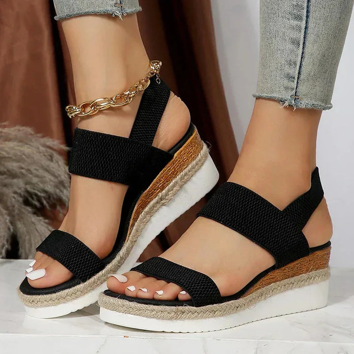 Brown wedge espadrille sandal, flat lay view showing full silhouette and sole profile