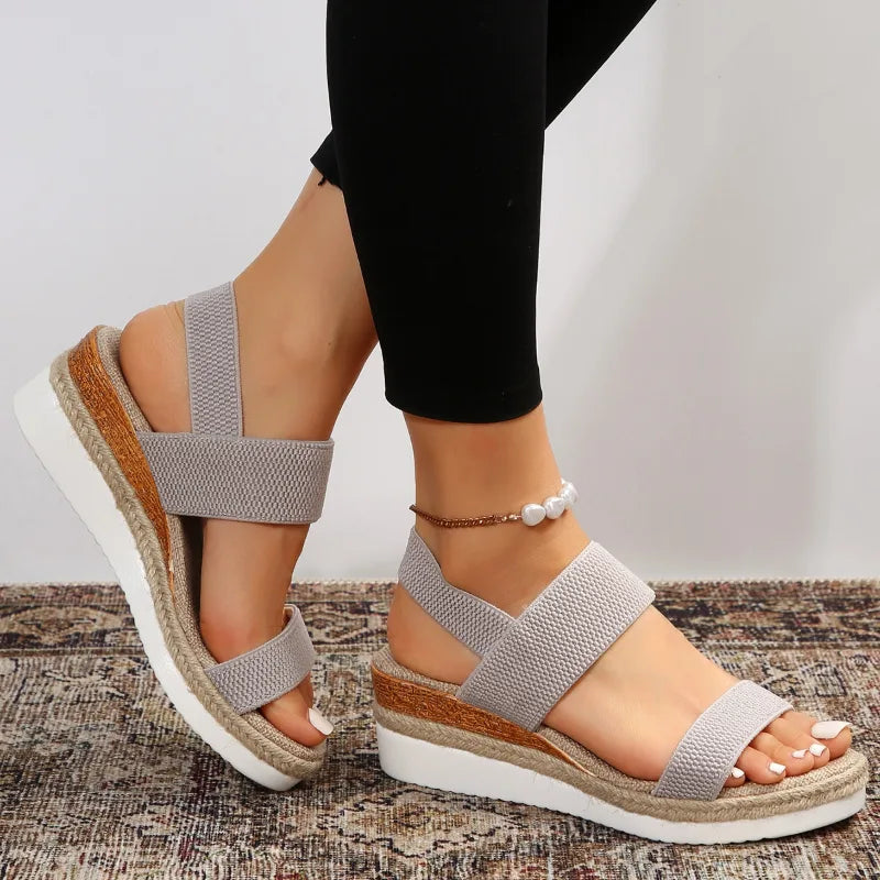 Brown wedge espadrille sandal, top-down view displaying footbed and strap layout