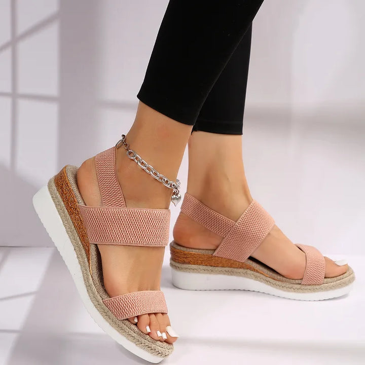 Brown wedge espadrille sandal, angled view highlighting wedge height and sole edge