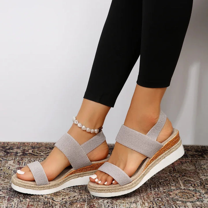 Gray wedge espadrille sandal, close-up detail of woven texture and sandal hardware