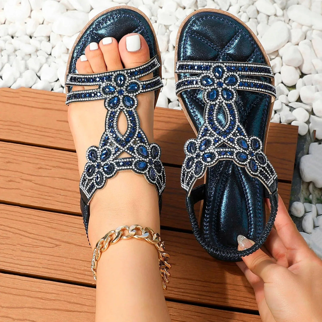 Blue rhinestone flat sandal with boho straps, heel view