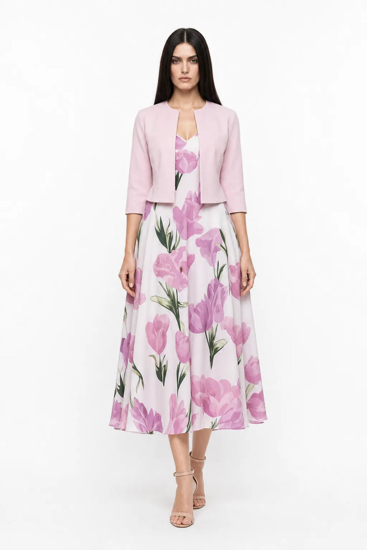 Pink floral midi dress set on model in contrapposto stance