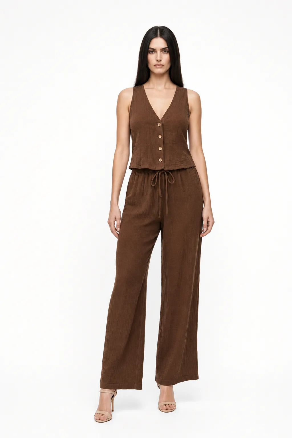 Brown button-front vest and matching trousers on a model in a contrapposto stance