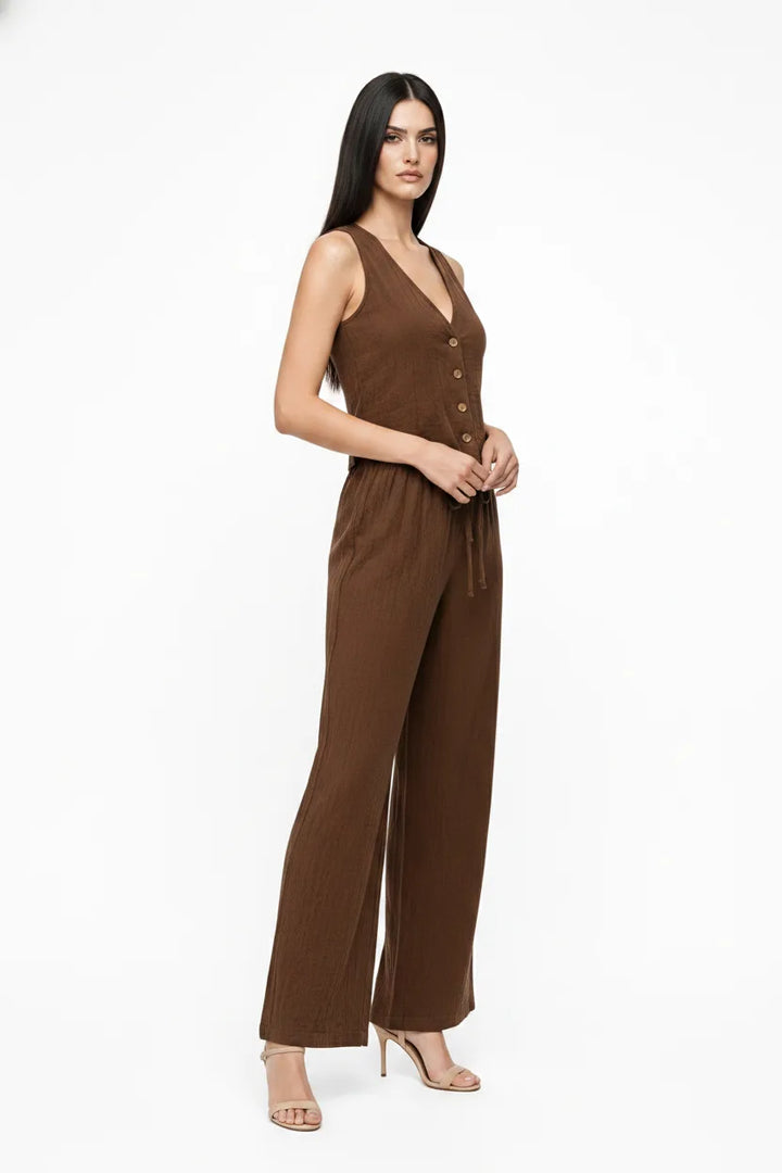 Brown button-front vest and matching trousers on a model in a three-quarter turn