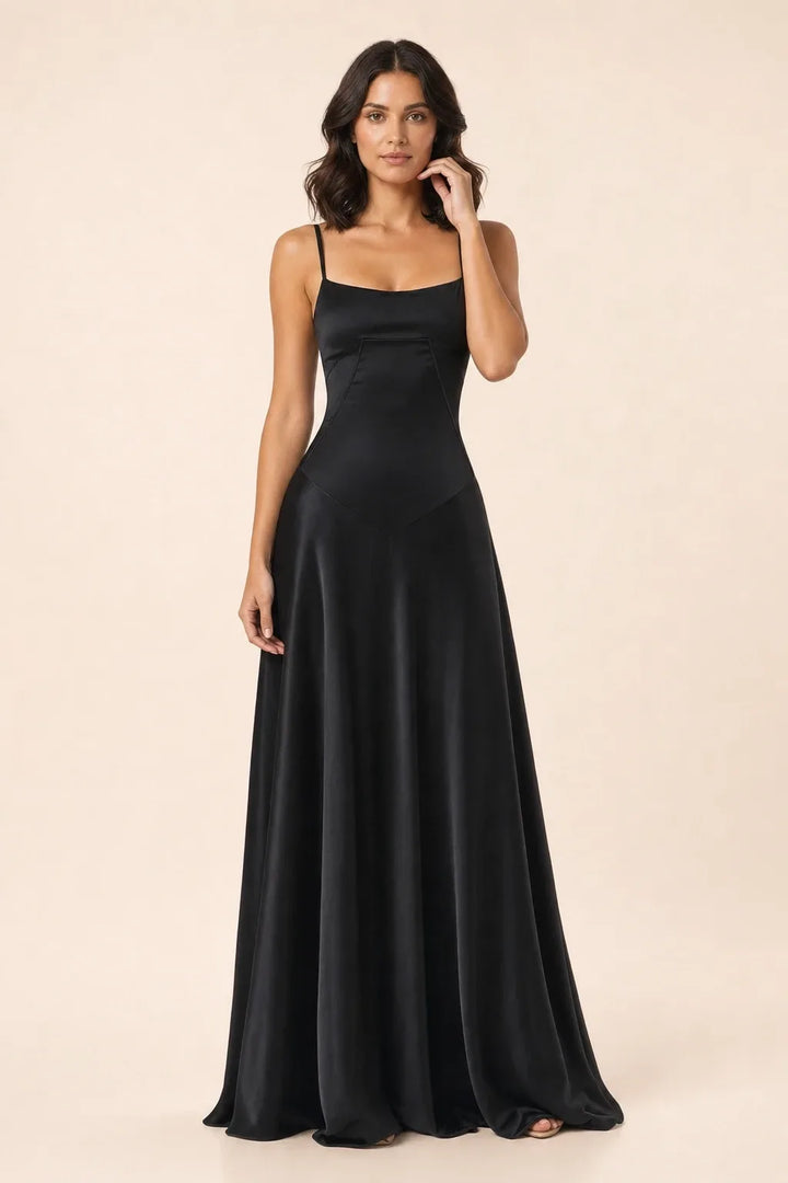 Black corset-seam maxi dress on a model in a contrapposto stance