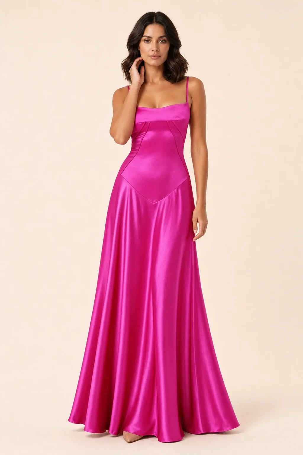 Pink corset-seam maxi dress on a model in a contrapposto stance