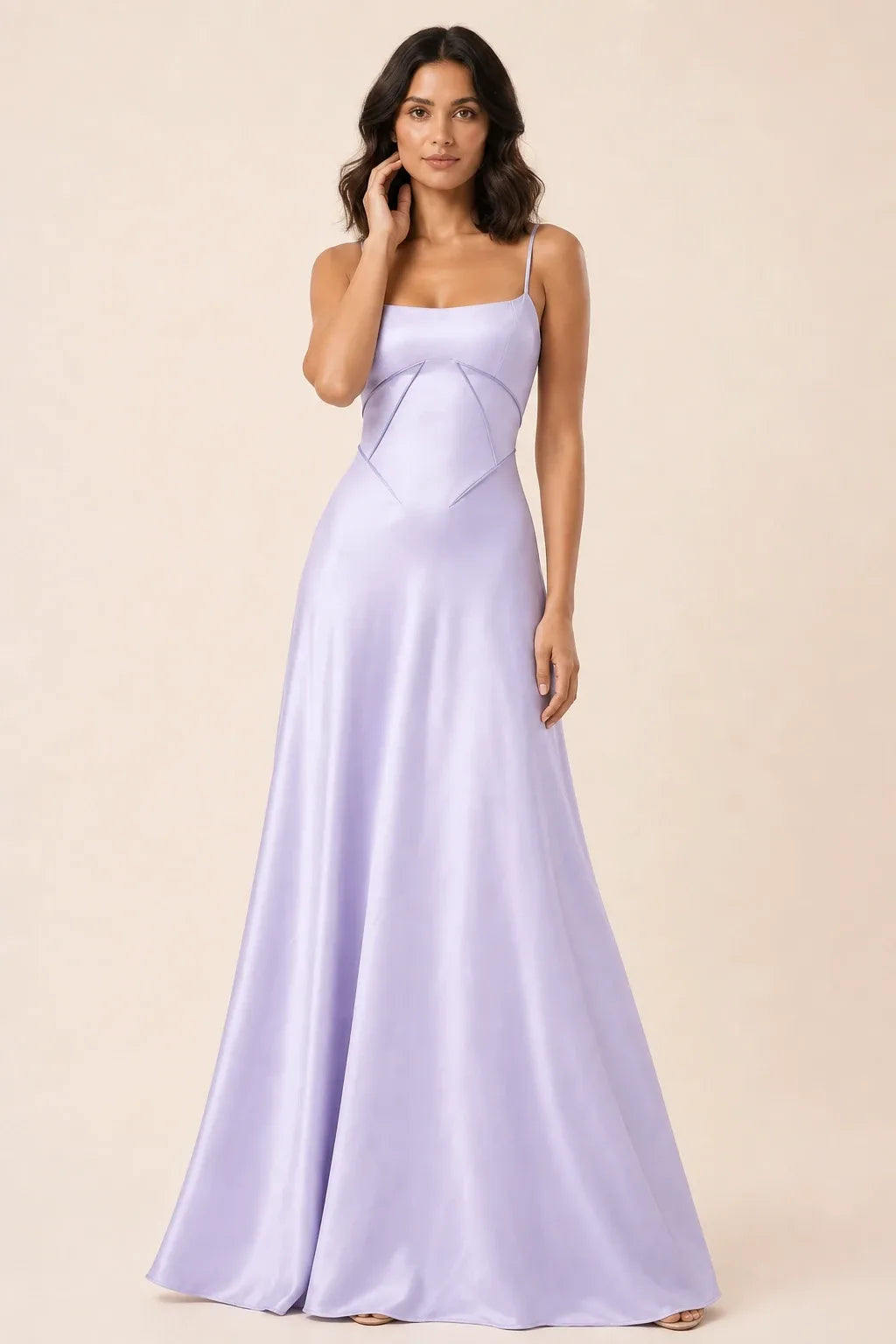 Purple corset-seam maxi dress on a model in a contrapposto stance