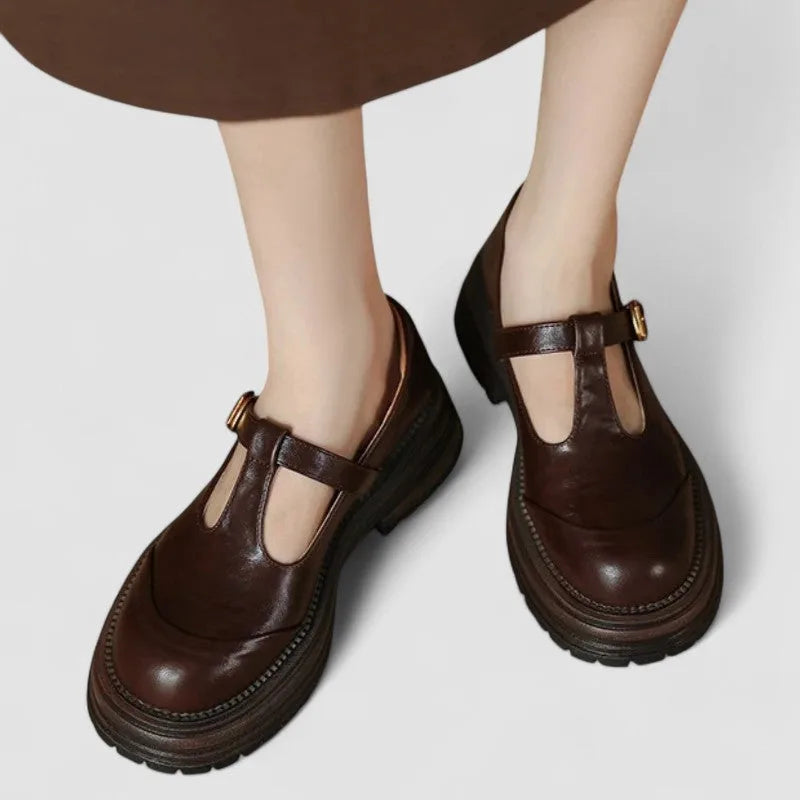 Brown platform T-bar Mary Jane shoe, front view showing strap and chunky sole