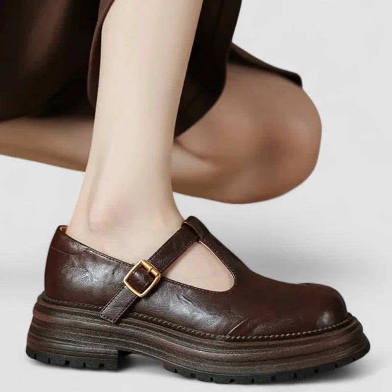 Brown platform T-bar Mary Jane shoe, three-quarter angle showing shape and platform