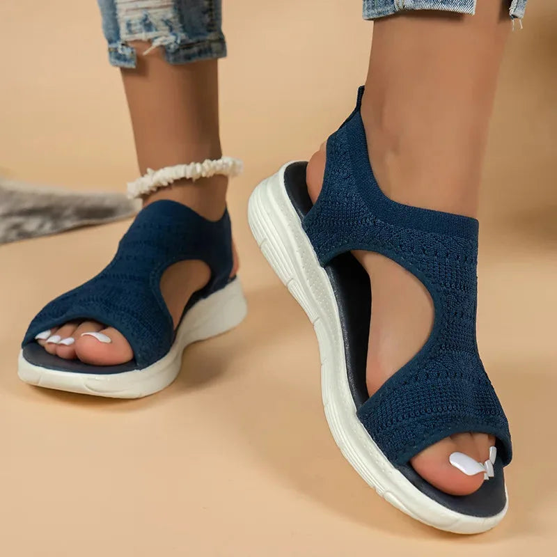 Black cutout platform sport sandal, close-up detail of cutout straps