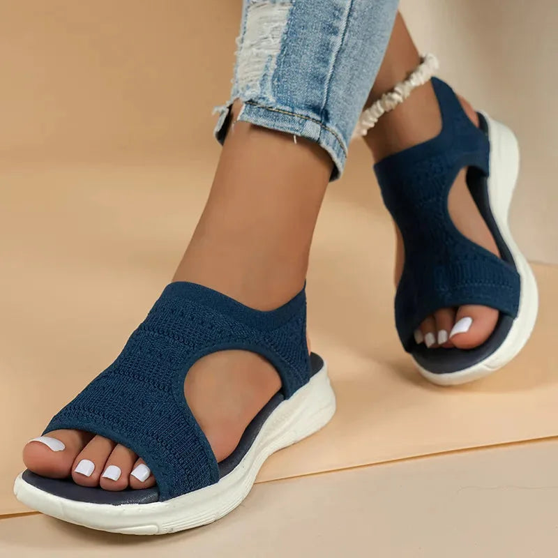 Black cutout platform sport sandal, heel view