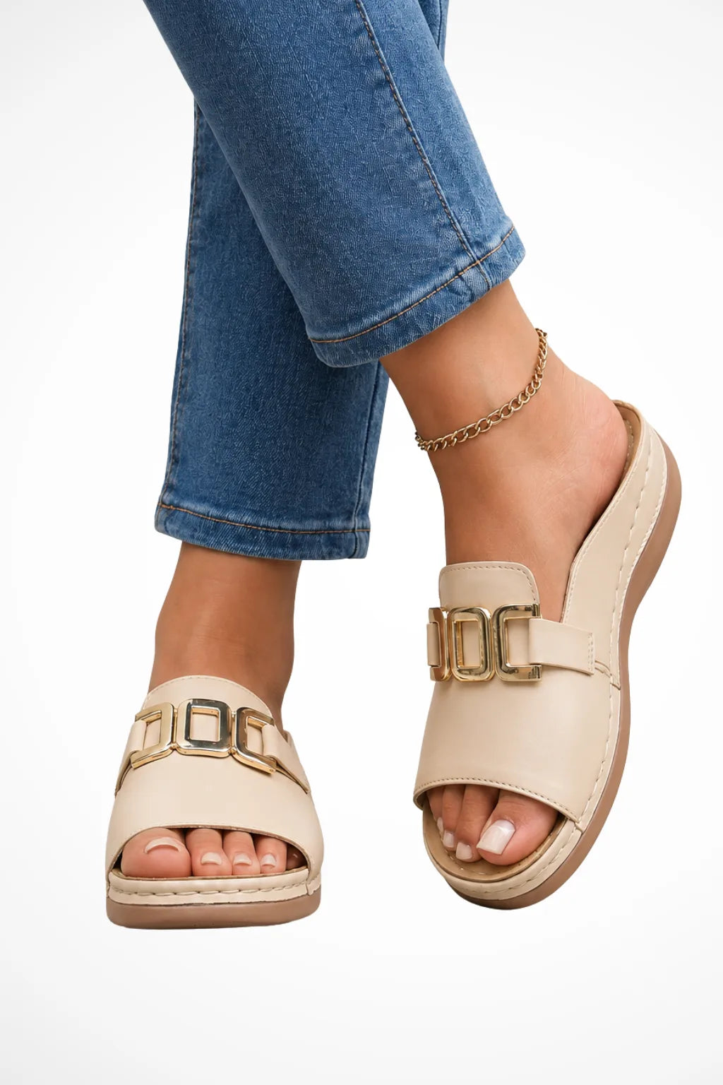 Beige slide sandal with gold hardware accent strap, front view