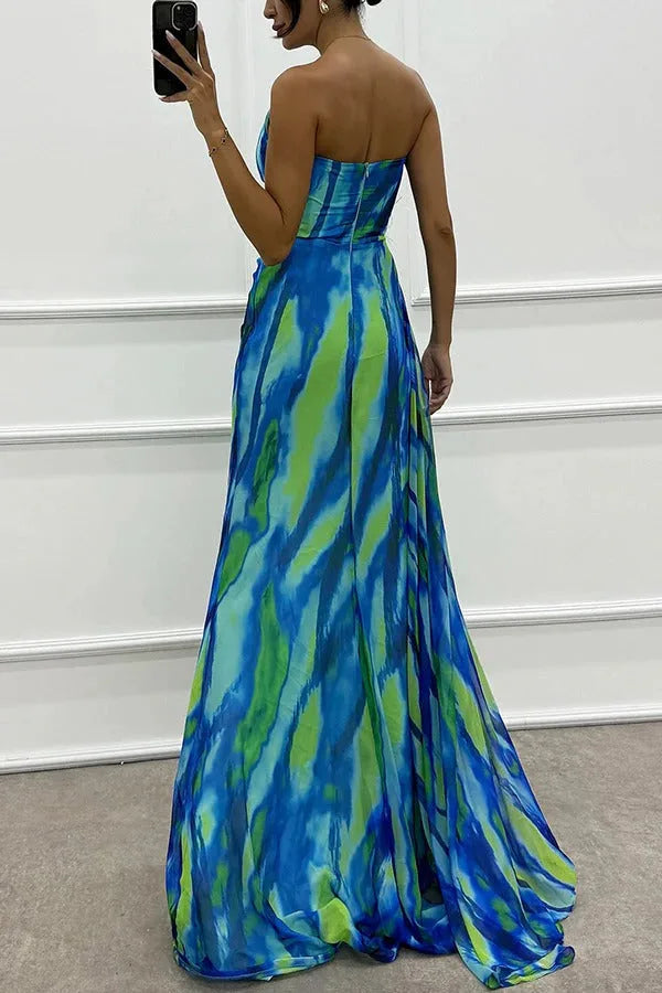 Model wearing a blue feather-trim maxi dress