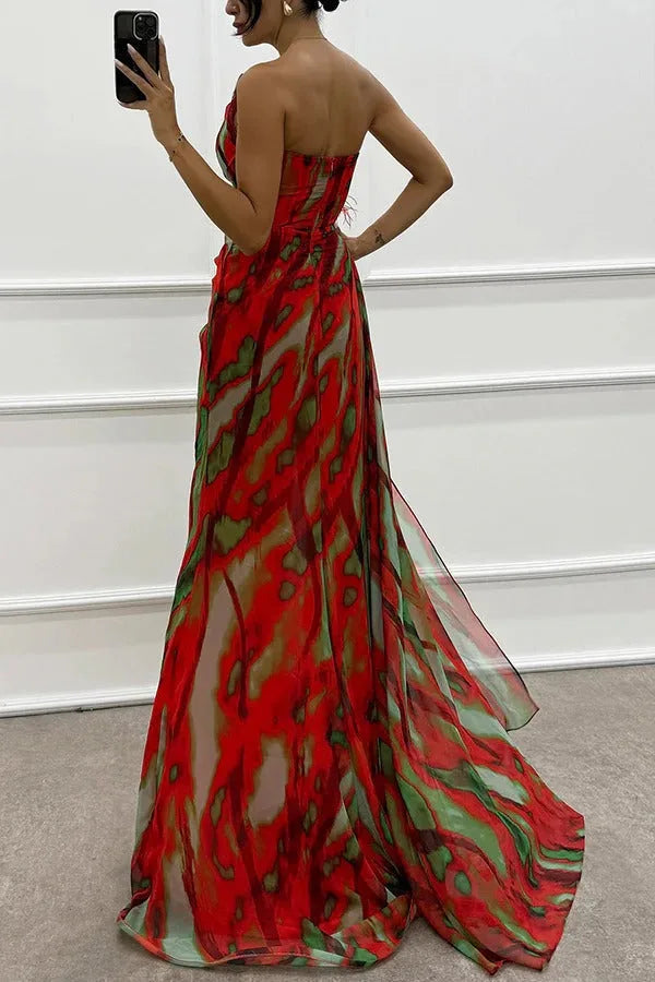 Model wearing a blue feather-trim maxi dress