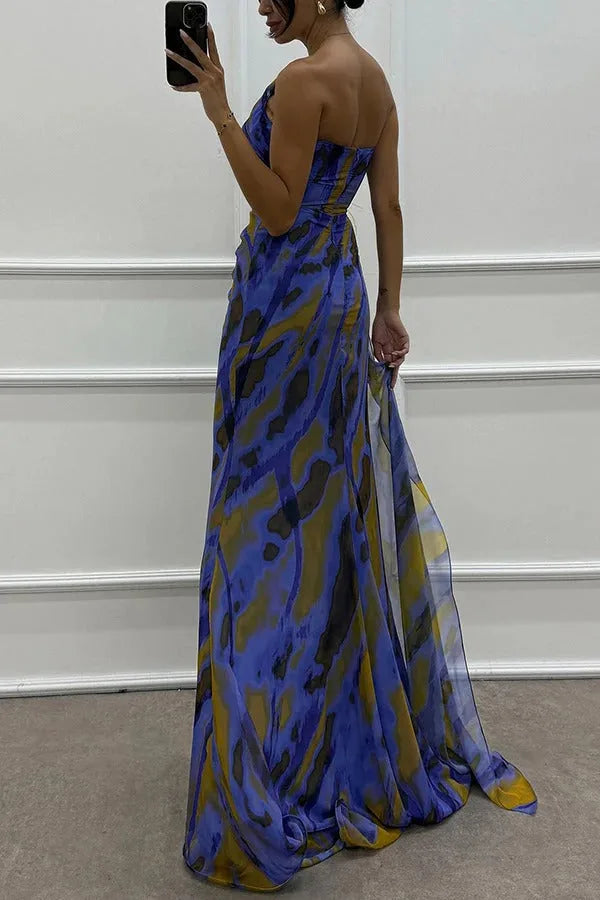 Model wearing a blue feather-trim maxi dress