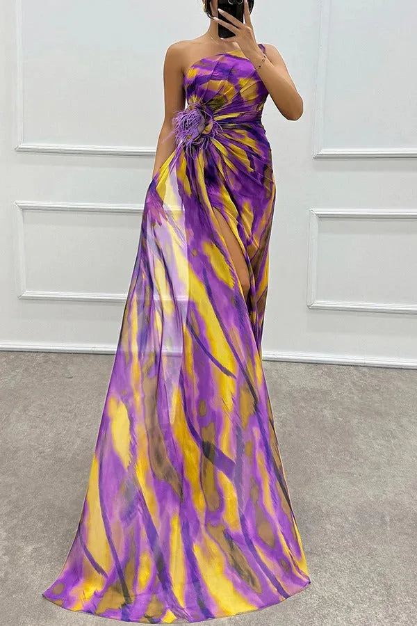 Model wearing a blue feather-trim maxi dress