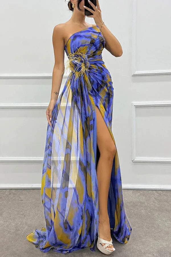 Model in side profile wearing a cyan feather-trim maxi dress