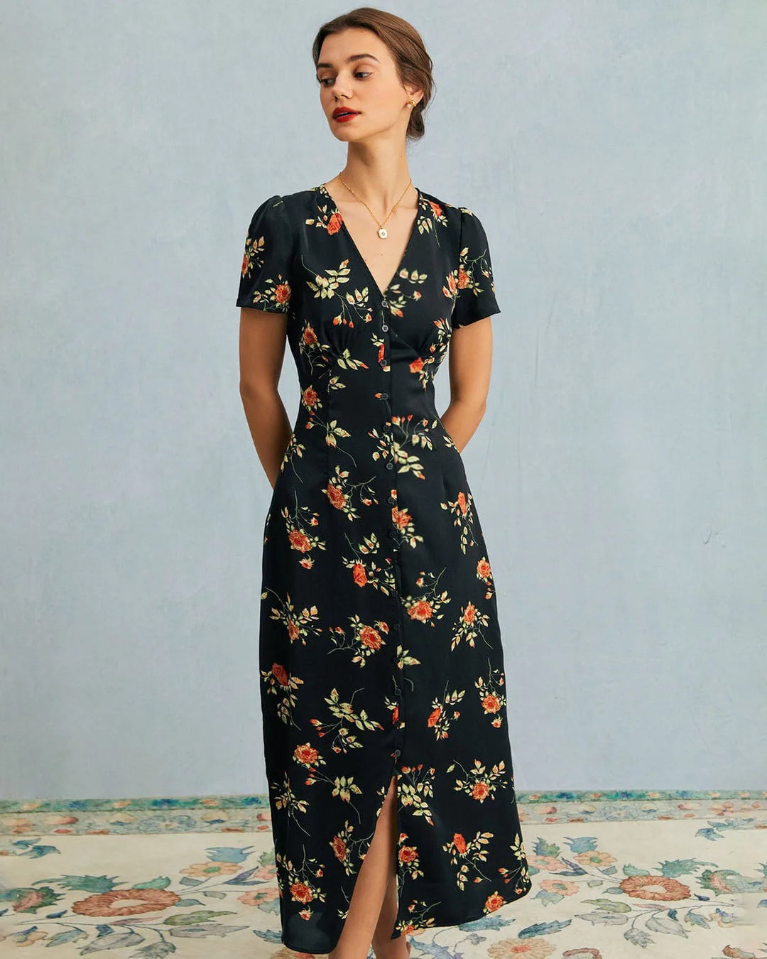 Close-up detail of black maxi dress floral print fabric texture