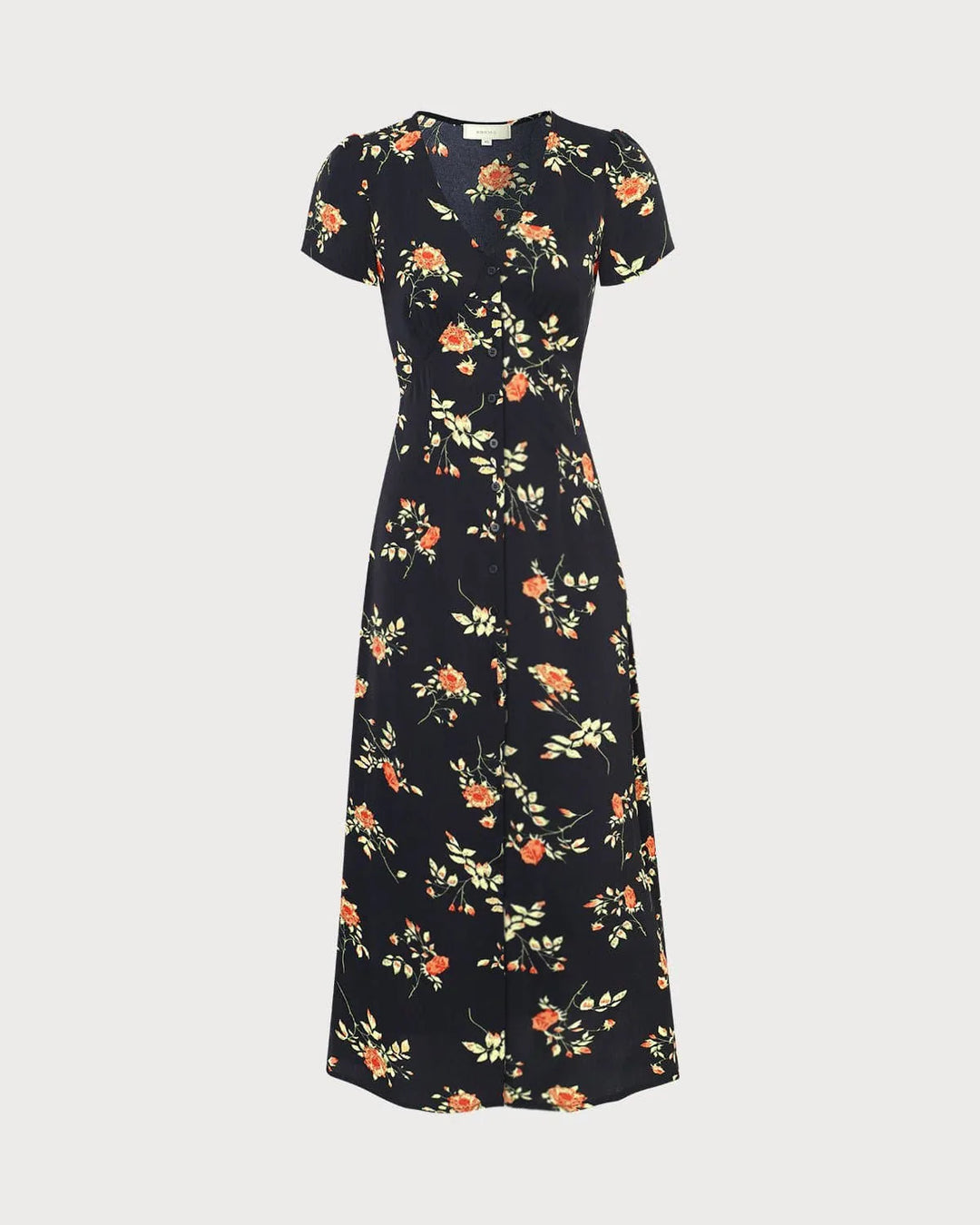Model in a black floral maxi dress capturing the full-length silhouette