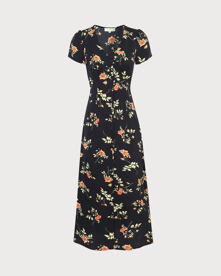 Model in a black floral maxi dress capturing the full-length silhouette