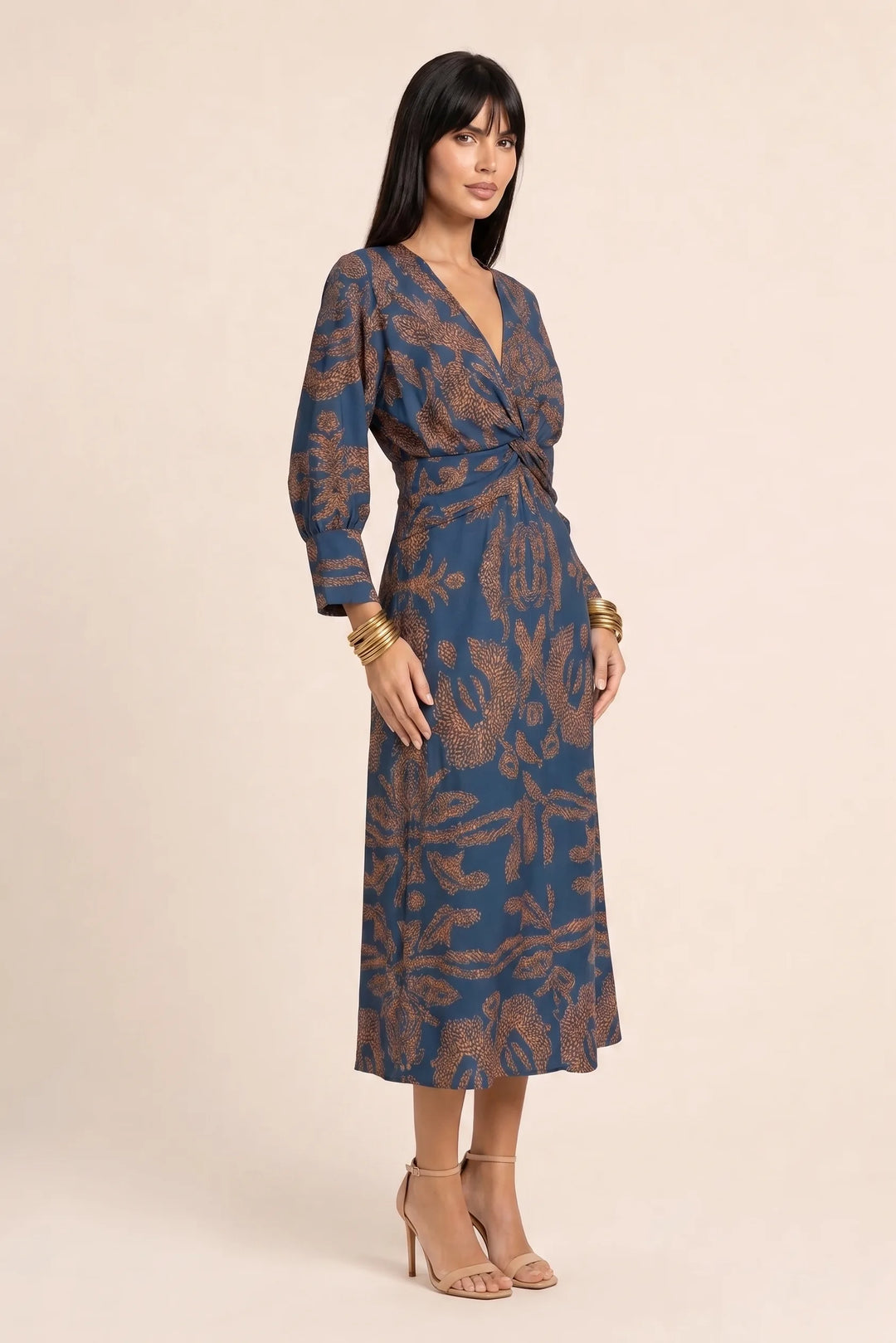 Blue twist-front midi dress on model in three-quarter turn