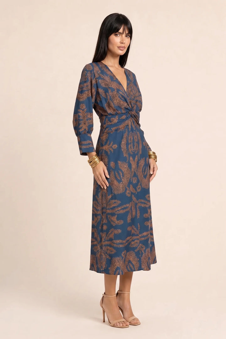 Blue twist-front midi dress on model in three-quarter turn