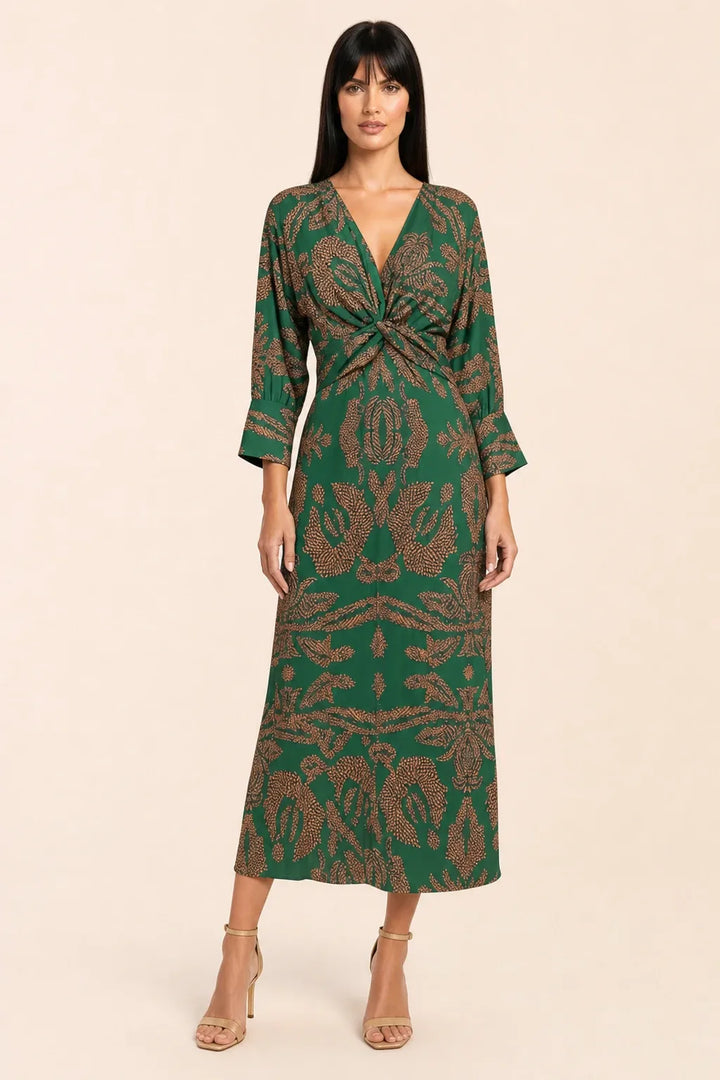 Green twist-front midi dress on model in contrapposto stance