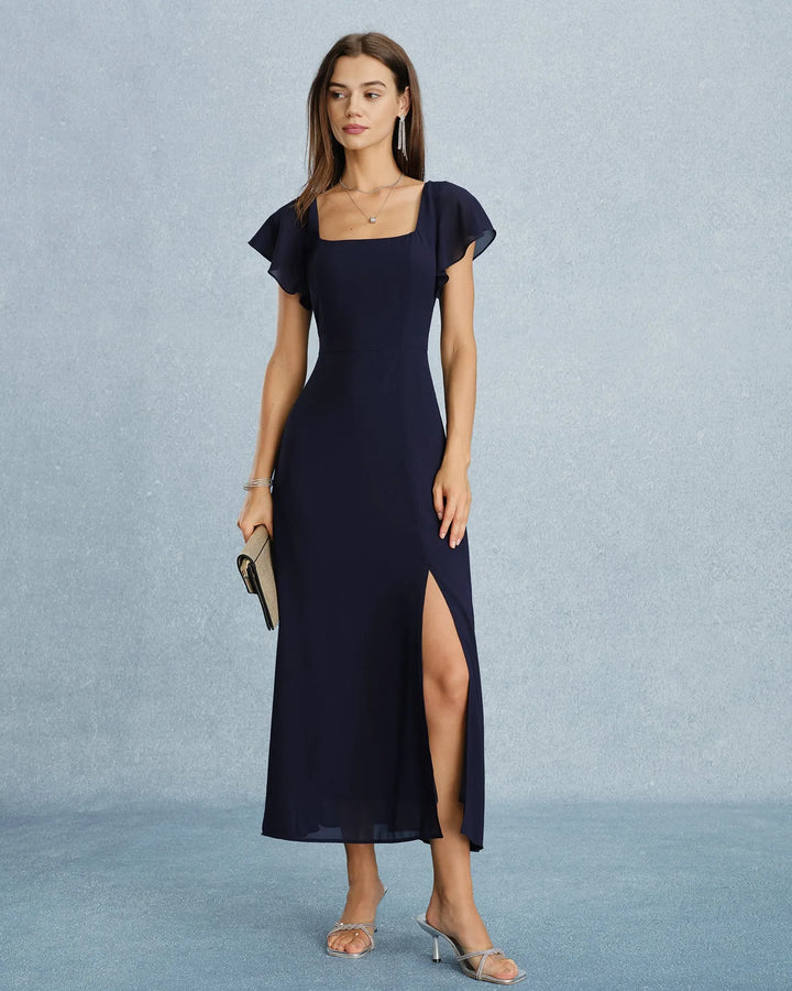 Navy blue flutter sleeve maxi dress on model facing forward