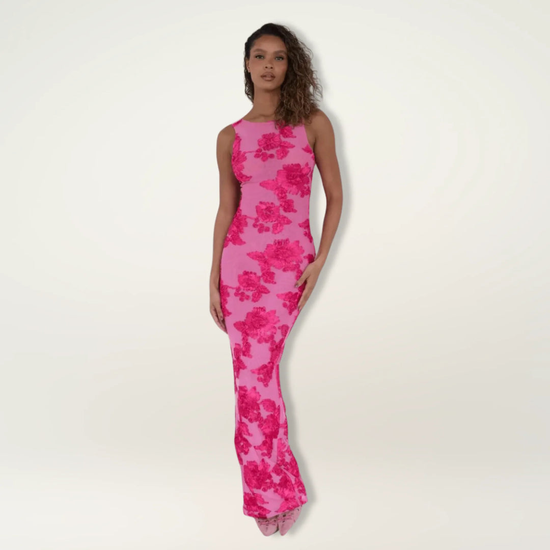 Woman facing forward in a floor-length beige burnout velvet gown with floral pattern