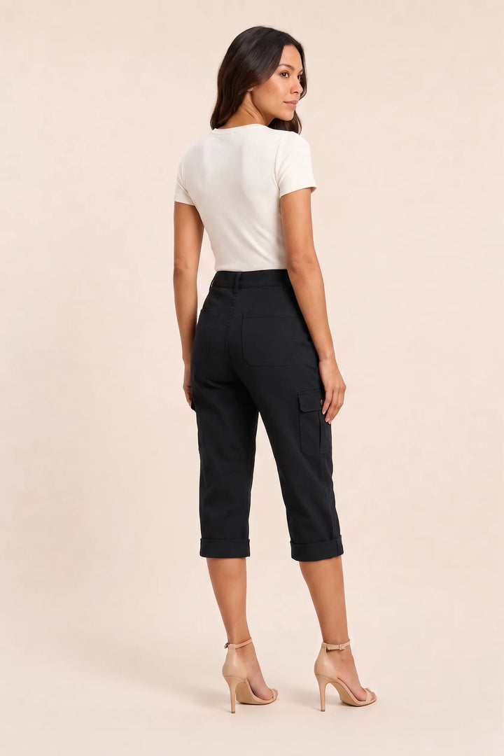 Black cargo capri pants with roll hem on model in three-quarter turn