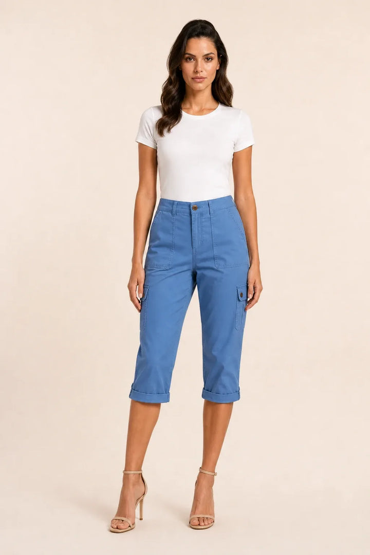 Blue cargo capri pants with roll hem on model in contrapposto stance