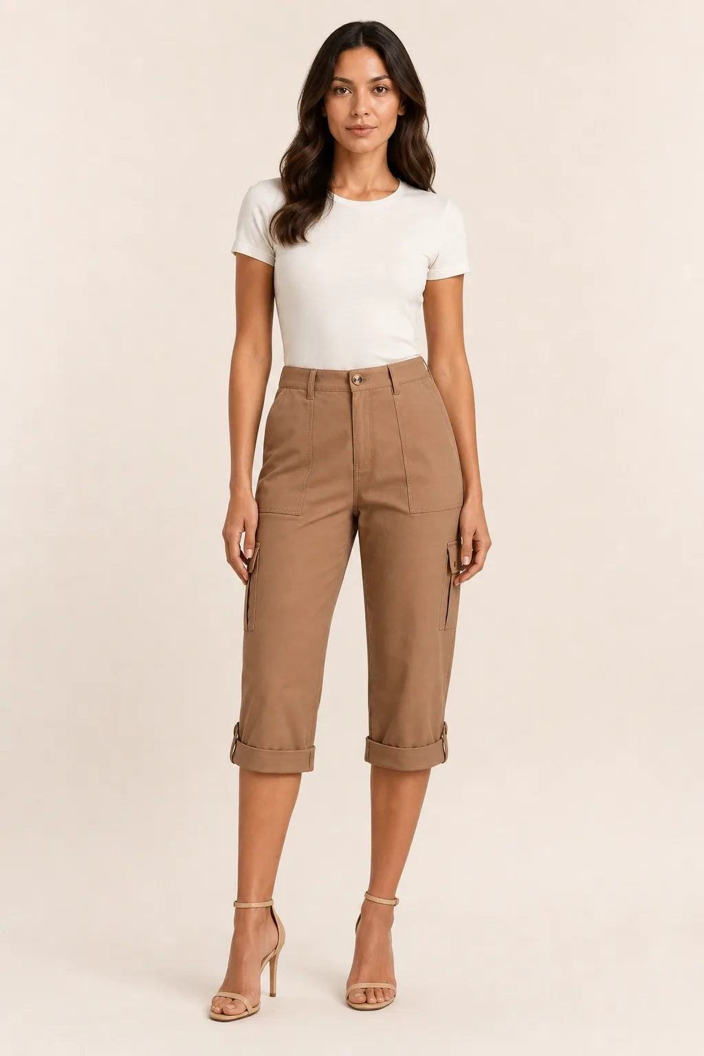 Coffee-colored cargo capri pants with roll hem on model in contrapposto stance