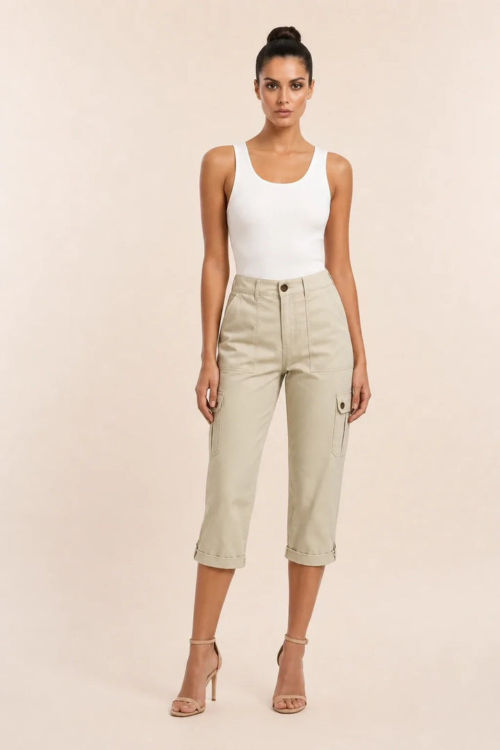 Khaki cargo capri pants with roll hem on model in contrapposto stance