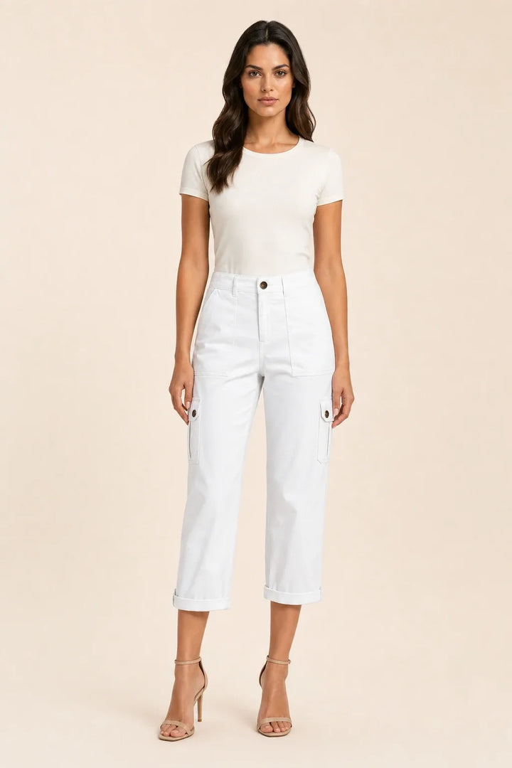 White cargo capri pants with roll hem on model in contrapposto stance