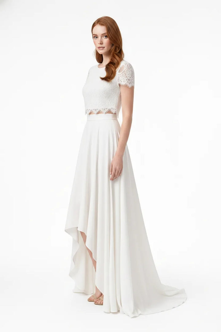 White lace crop bridal top and skirt set on model in three-quarter turn