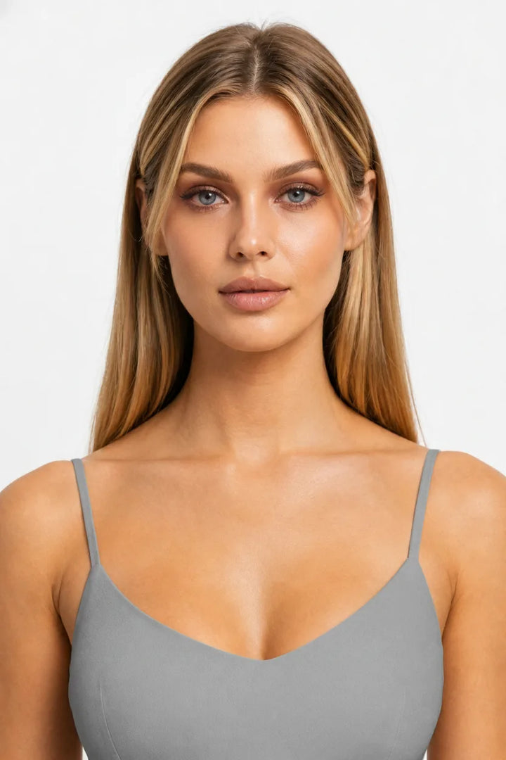 Model wearing oversized octagonal rimless sunglasses in grey, front-facing close-up