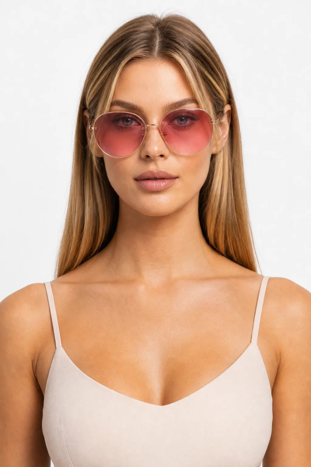 Model wearing oversized octagonal rimless sunglasses in pink, front-facing close-up