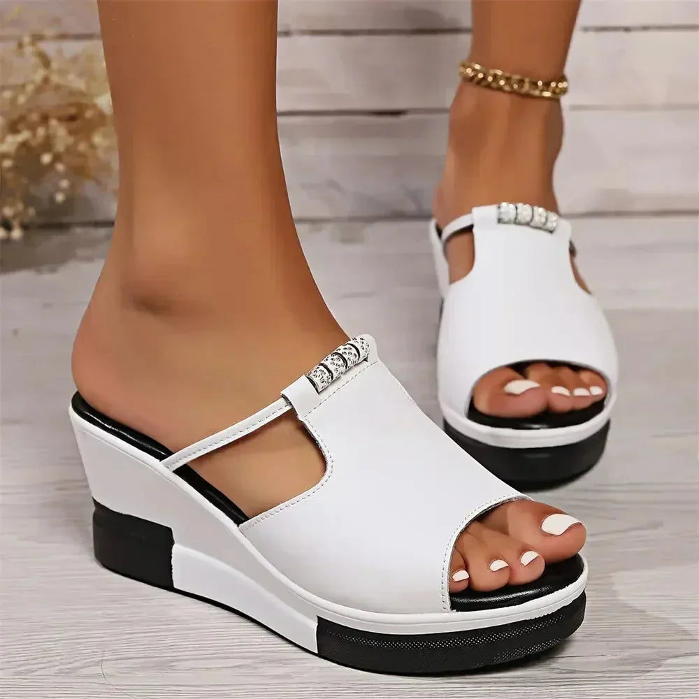 White platform wedge mule shown from the heel