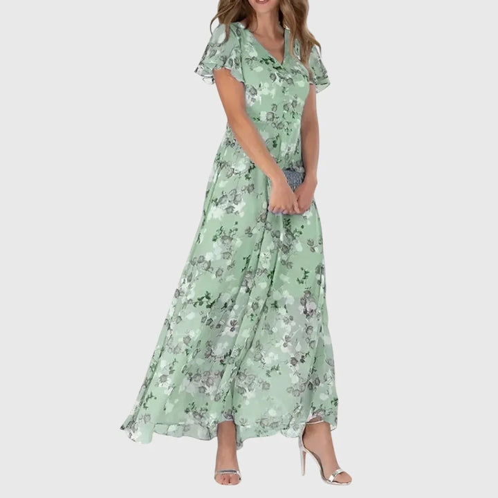 Green floral chiffon maxi dress on model in side profile
