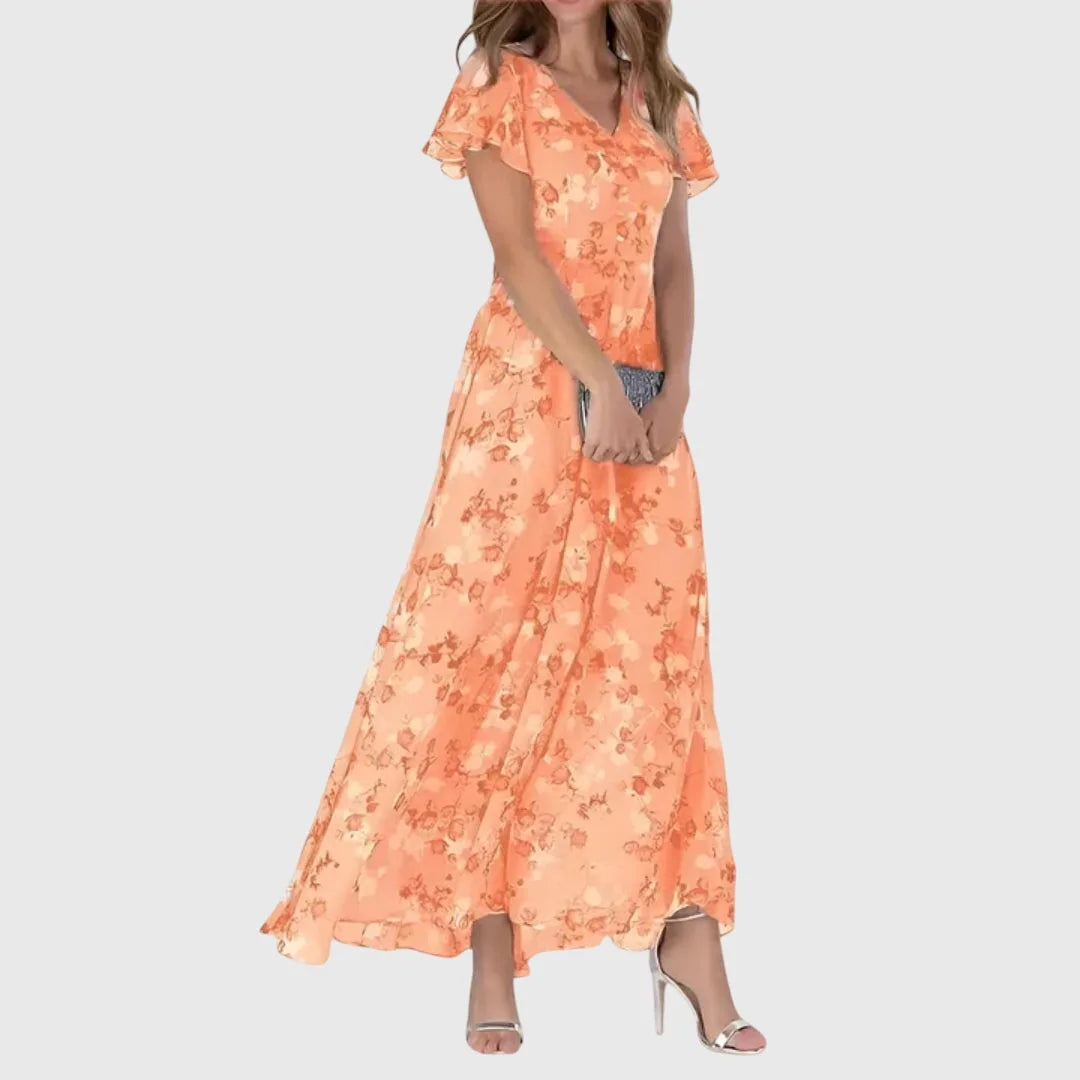 Orange floral chiffon maxi dress on model facing forward