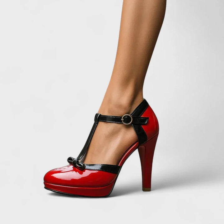 Close-up detail of pink t-strap platform pump strap and toe construction