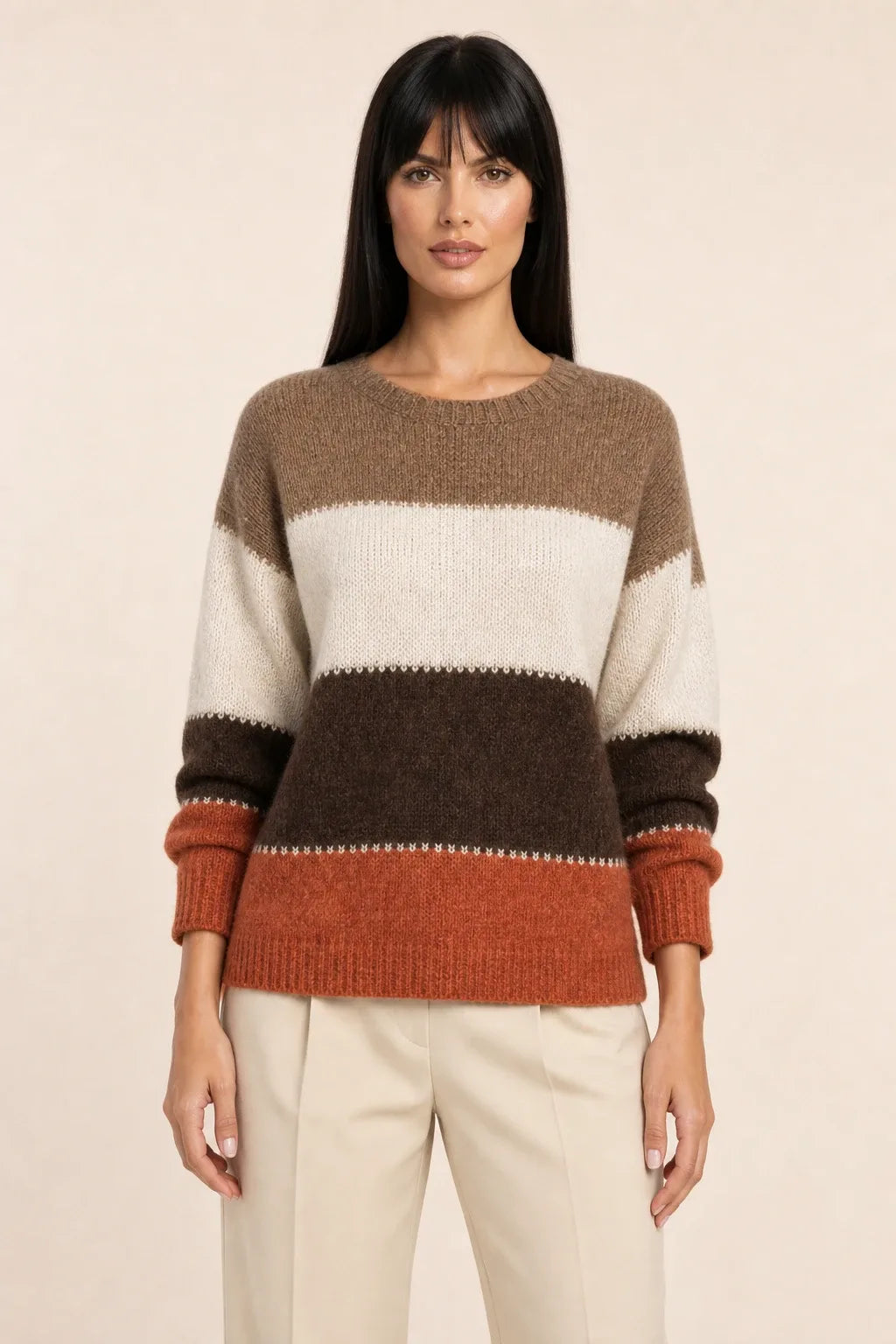 Red colorblock stripe knit top on model in contrapposto stance