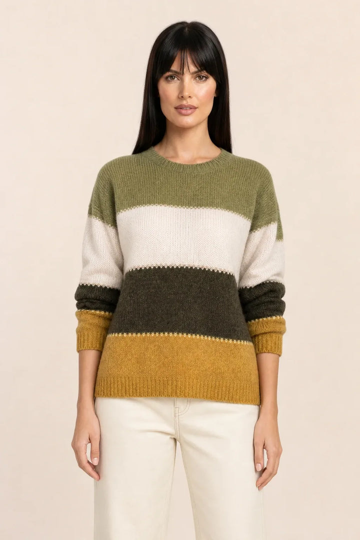 Yellow colorblock stripe knit top on model in contrapposto stance