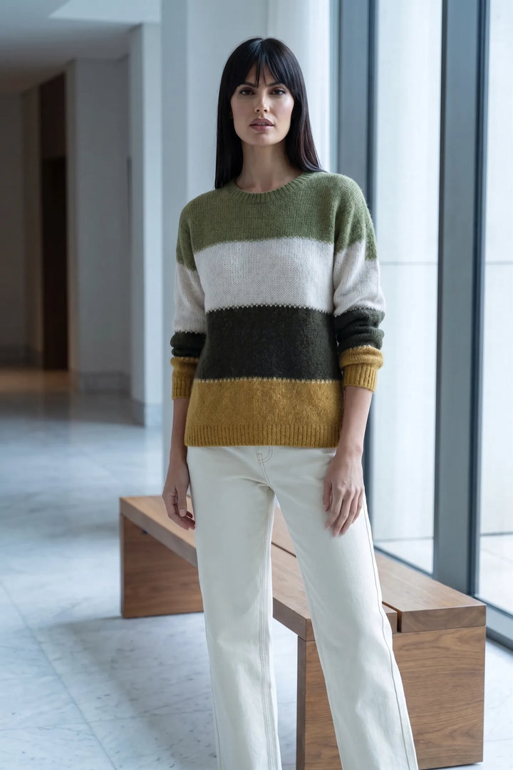Model wearing yellow colorblock stripe knit top in lifestyle setting