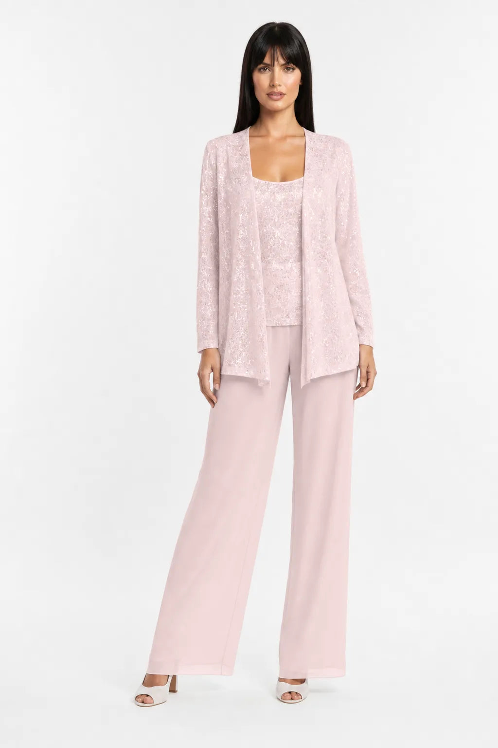 Light pink sequin lace three-piece set on model in contrapposto stance