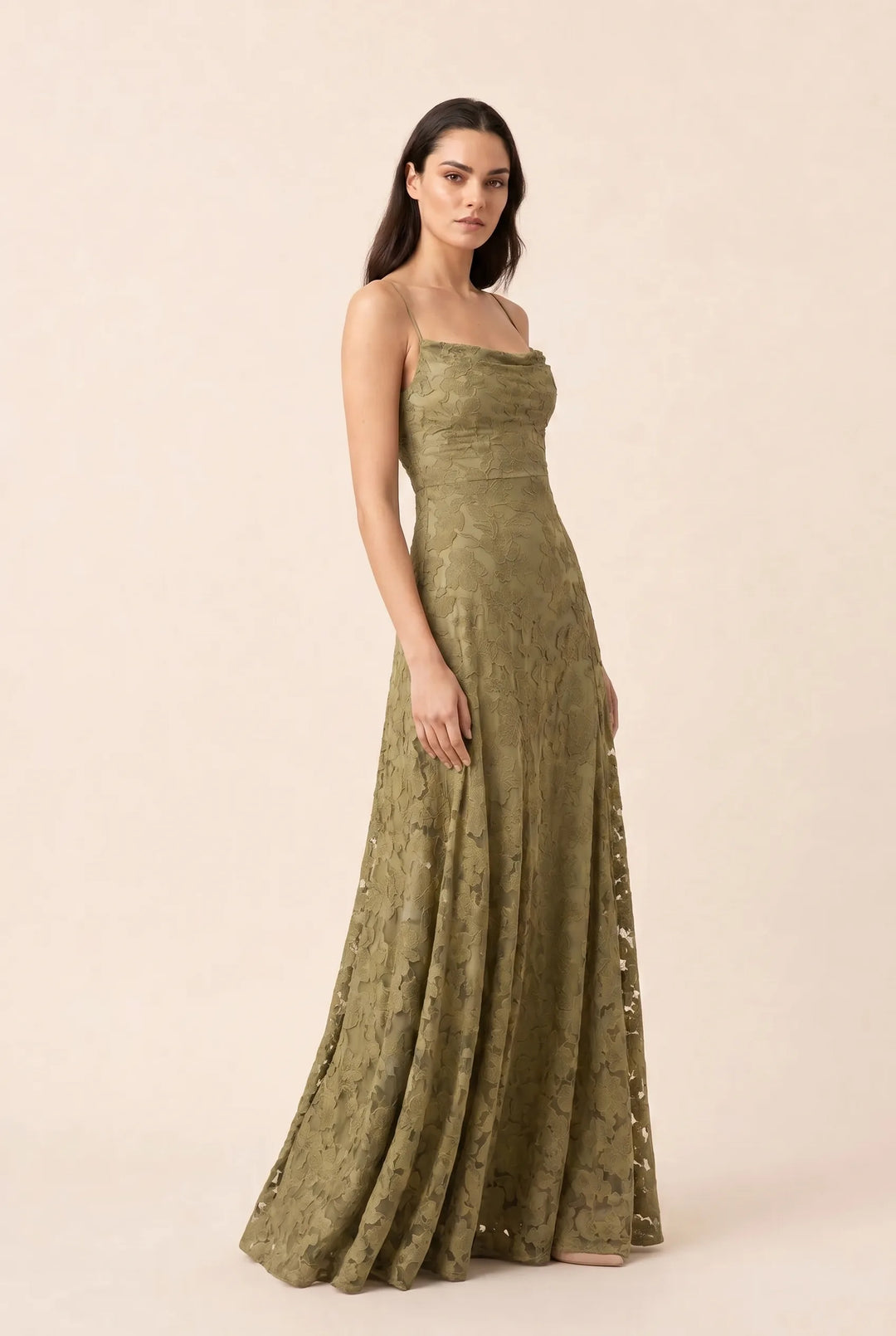 Olive green lace appliqué gown on model in three-quarter turn